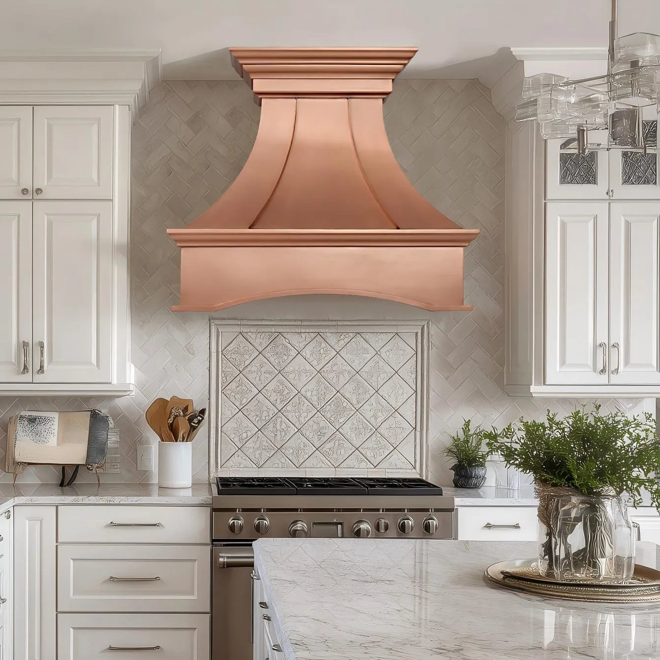 Natural copper range hood with geometric design and arched apron in a modern kitchen