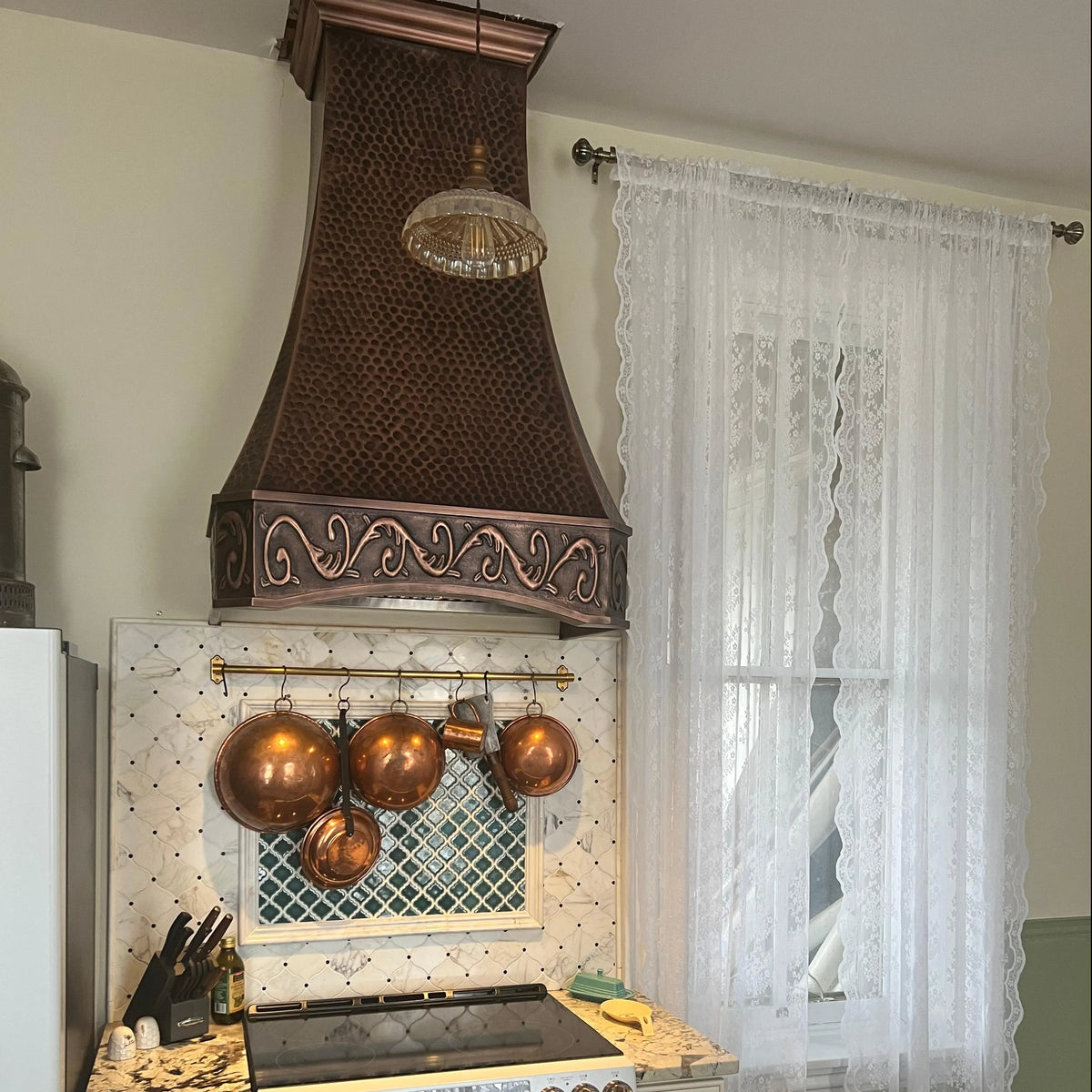 Fobest antique copper range hood in a cozy vintage kitchen, the warm copper finish adding depth, character, and an inviting old-world feel.