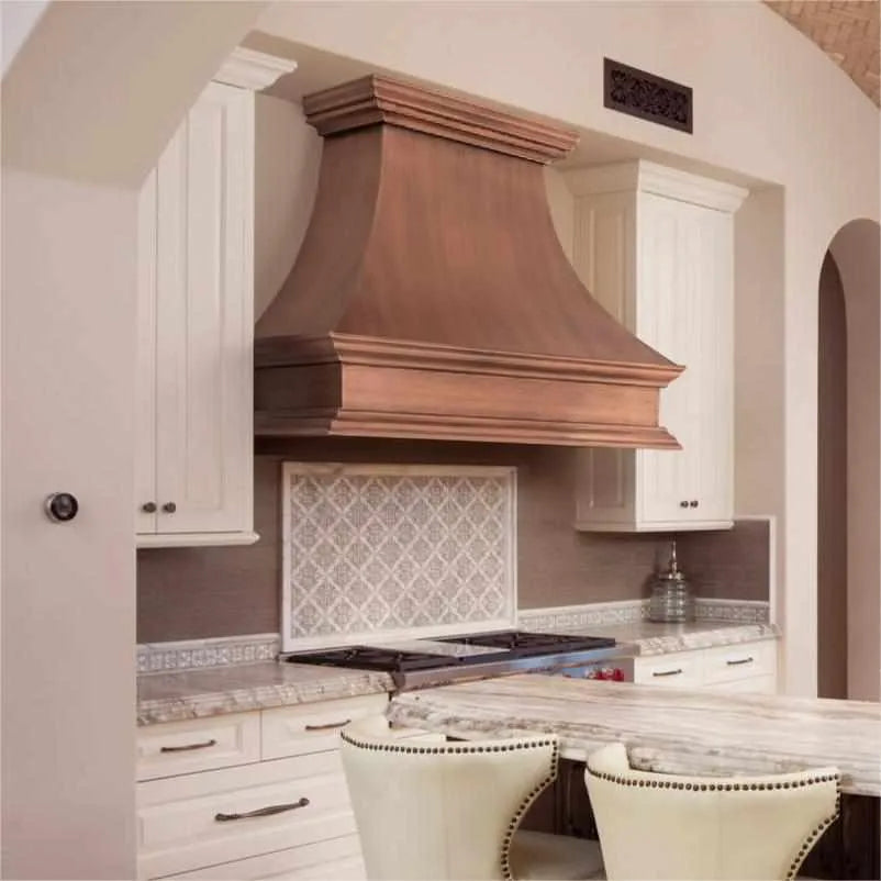 FOBEST Antique copper range hood with a classic retro curved shape and a crown design, installed in a kitchen setting.