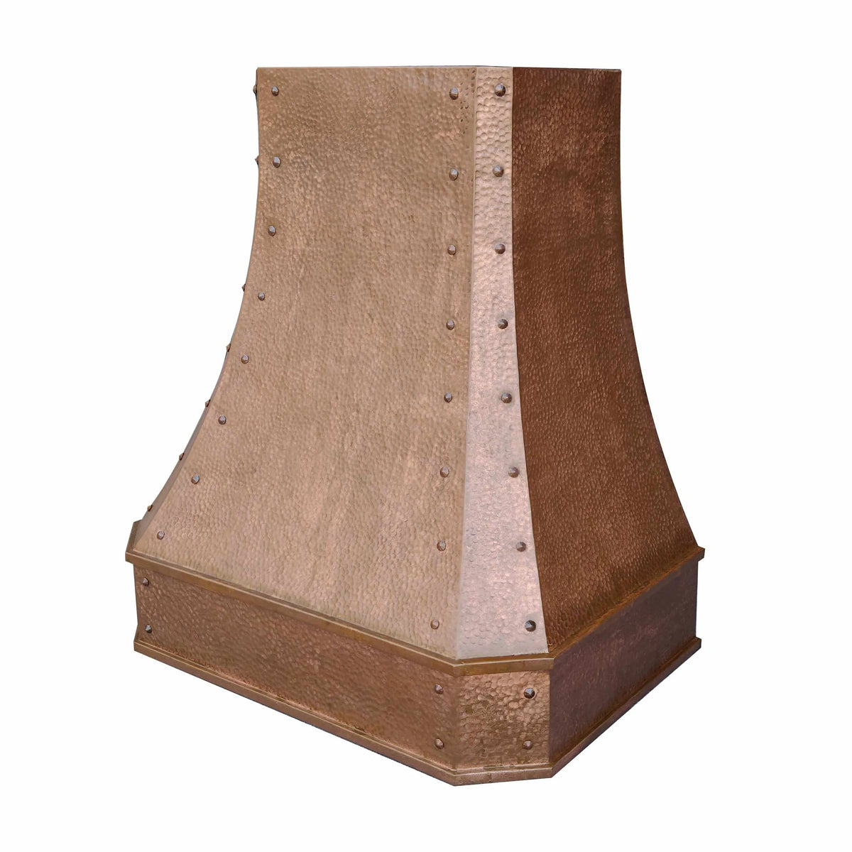 A vintage copper range hood with a classic curved shape and hammered textured surface, featuring rivets and an apron.