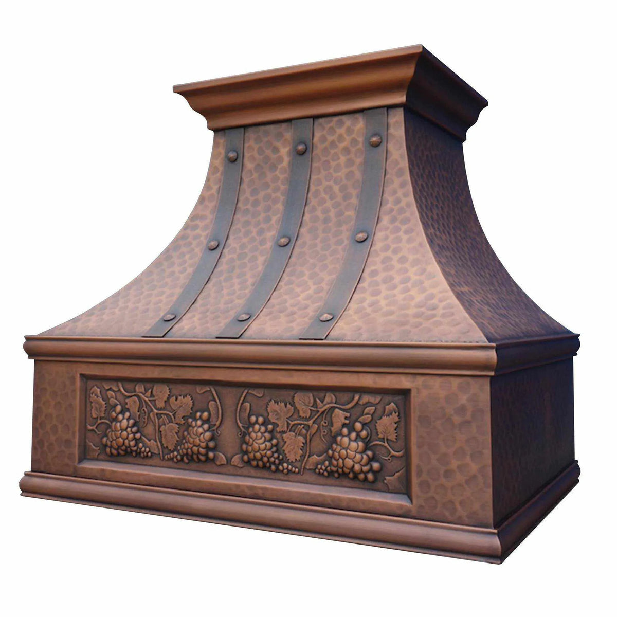 Hammered Antique copper finish custom range hood with carved grape designs and rivet detailing.