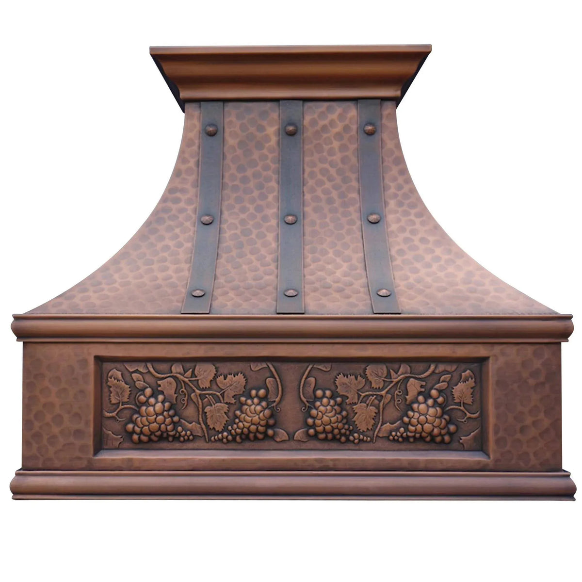 Antique copper finish custom range hood with carved grape designs and rivet detailing.