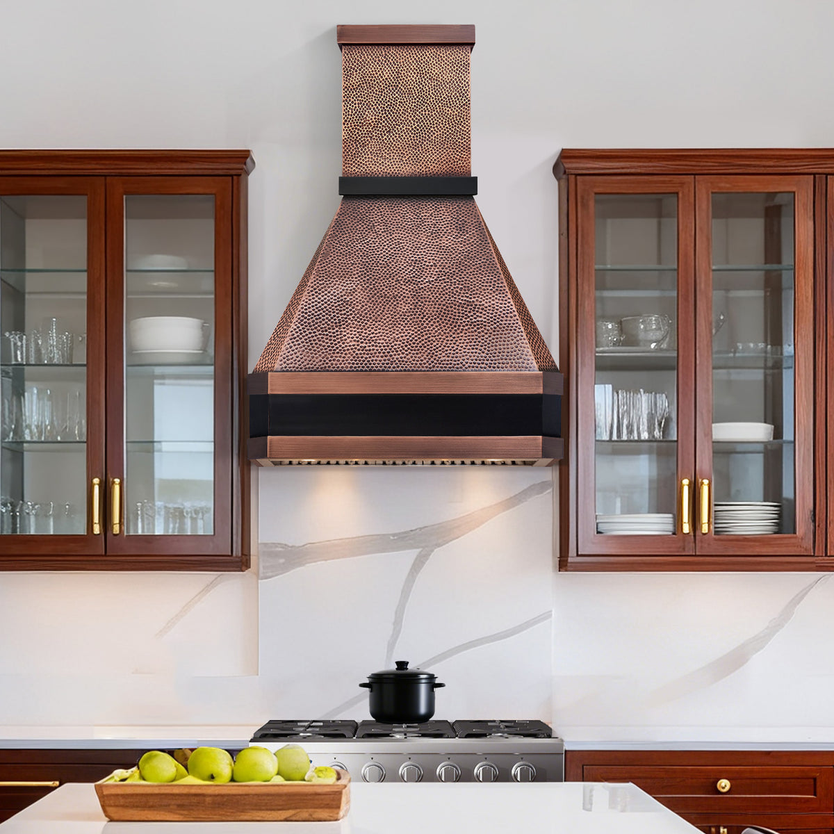 Kitchen with copper range hood, wooden cabinets, and a stove.