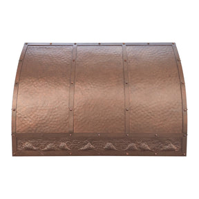 Copper stove hood with textured surface and decorative elements 