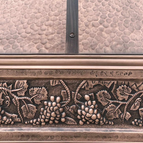 Antique copper range hood with hand curved apron design