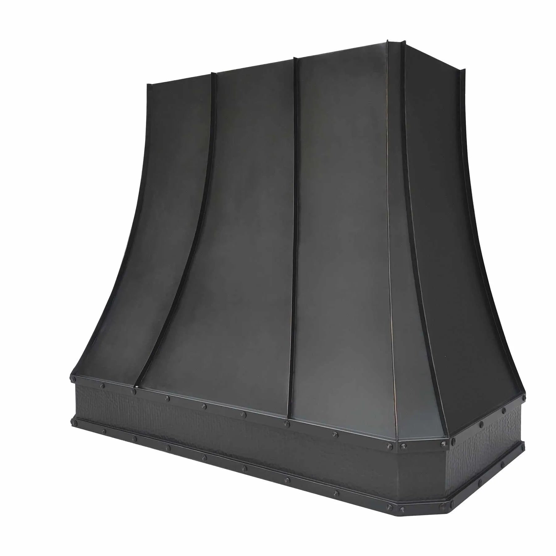 A bronze copper range hood with rivet details, handcrafted hammered texture on the apron.