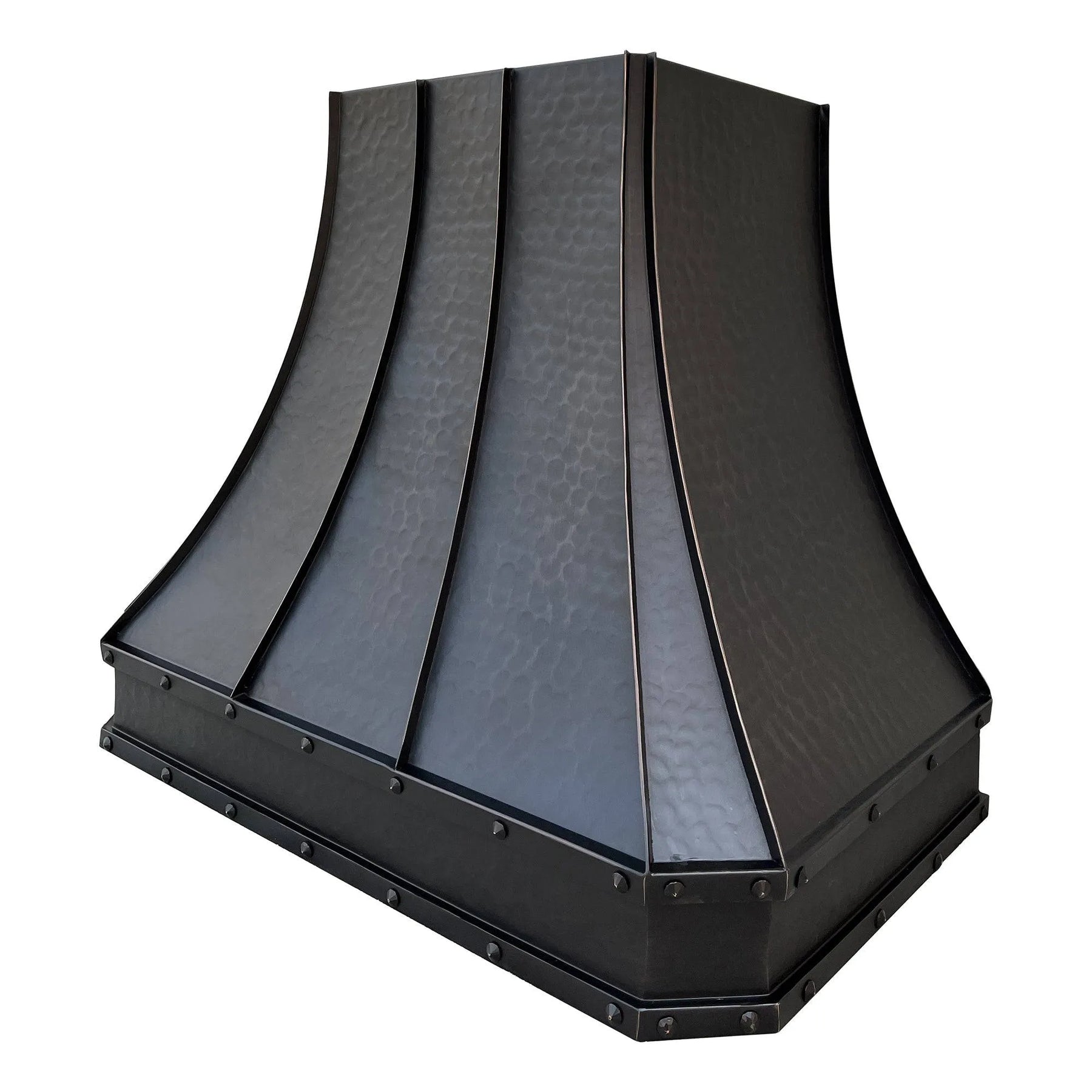 A bronze copper range hood with rivet details, displayed in a kitchen setting above a cooking area.