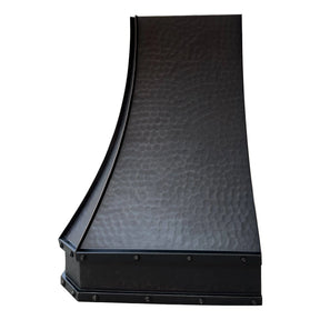 A bronze copper range hood with rivet details, and light hammered body texture.