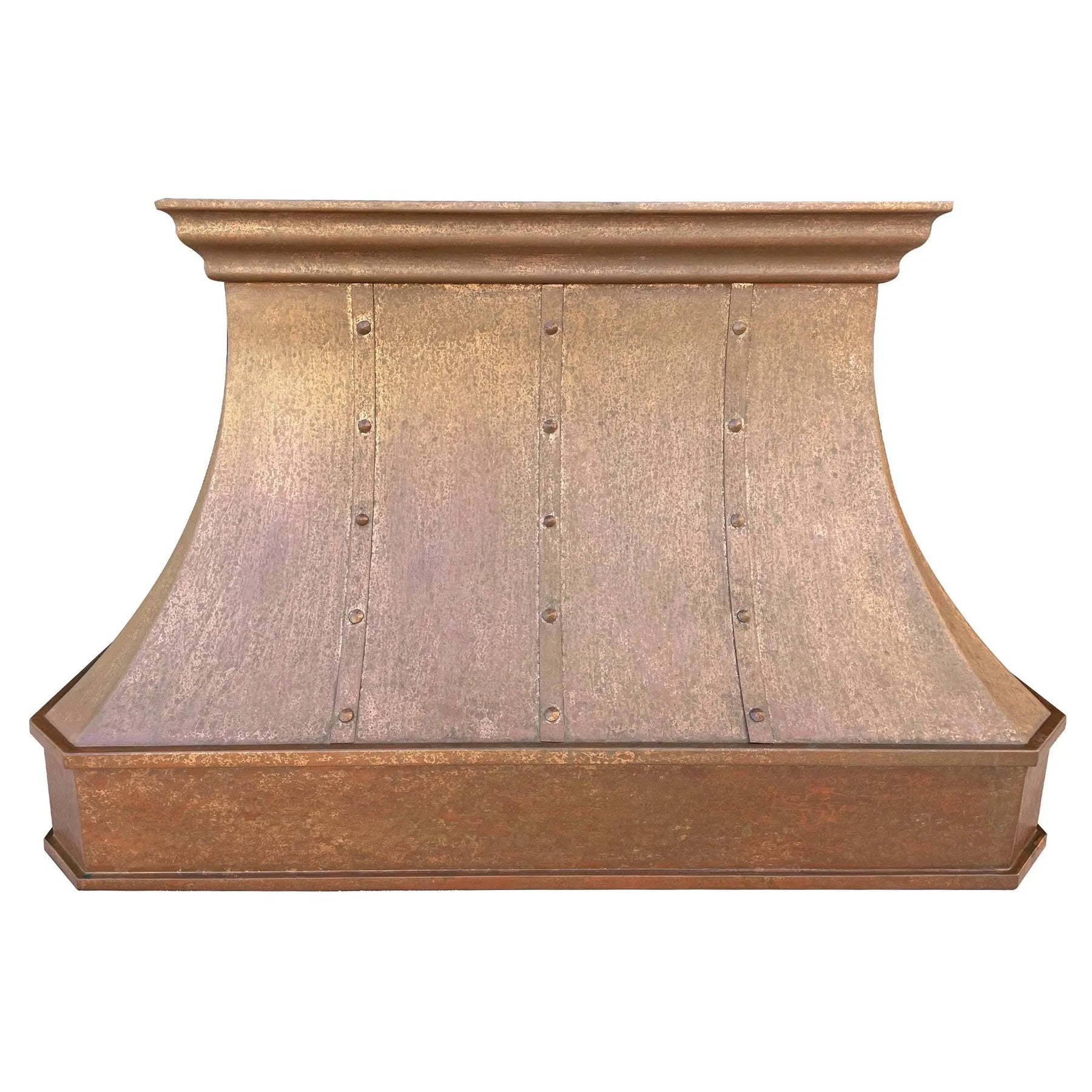 A handmade vintage copper range hood installed above a kitchen stovetop, featuring a curved design with rivets and straps.
