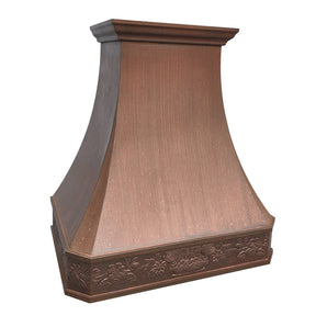 A handmade vintage copper range hood with a custom pattern, featuring a smooth, curved design.