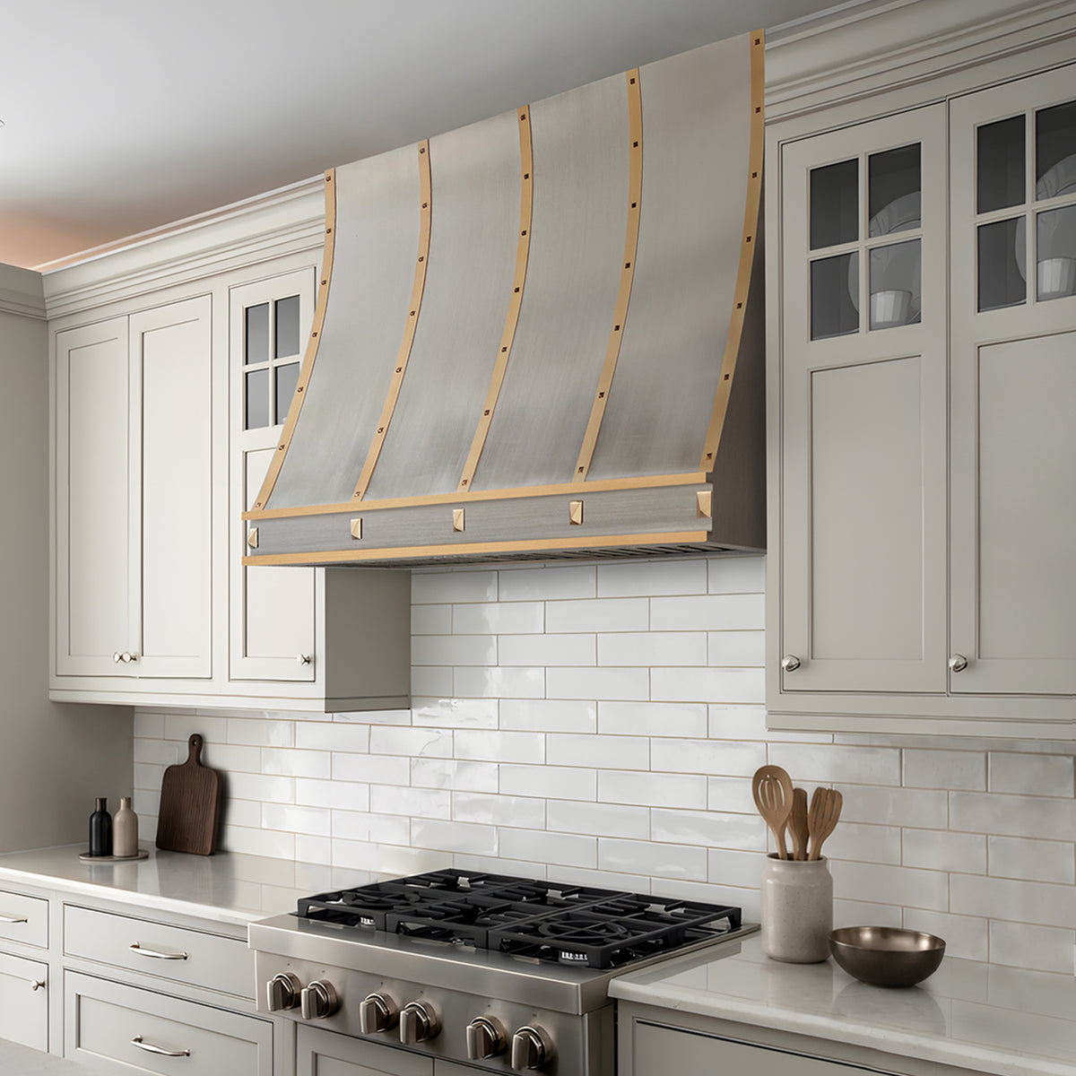 Fobest Custom Sloped Stainless Steel Range Hood with Brushed Brass Accents and Rivet Details FSS-685