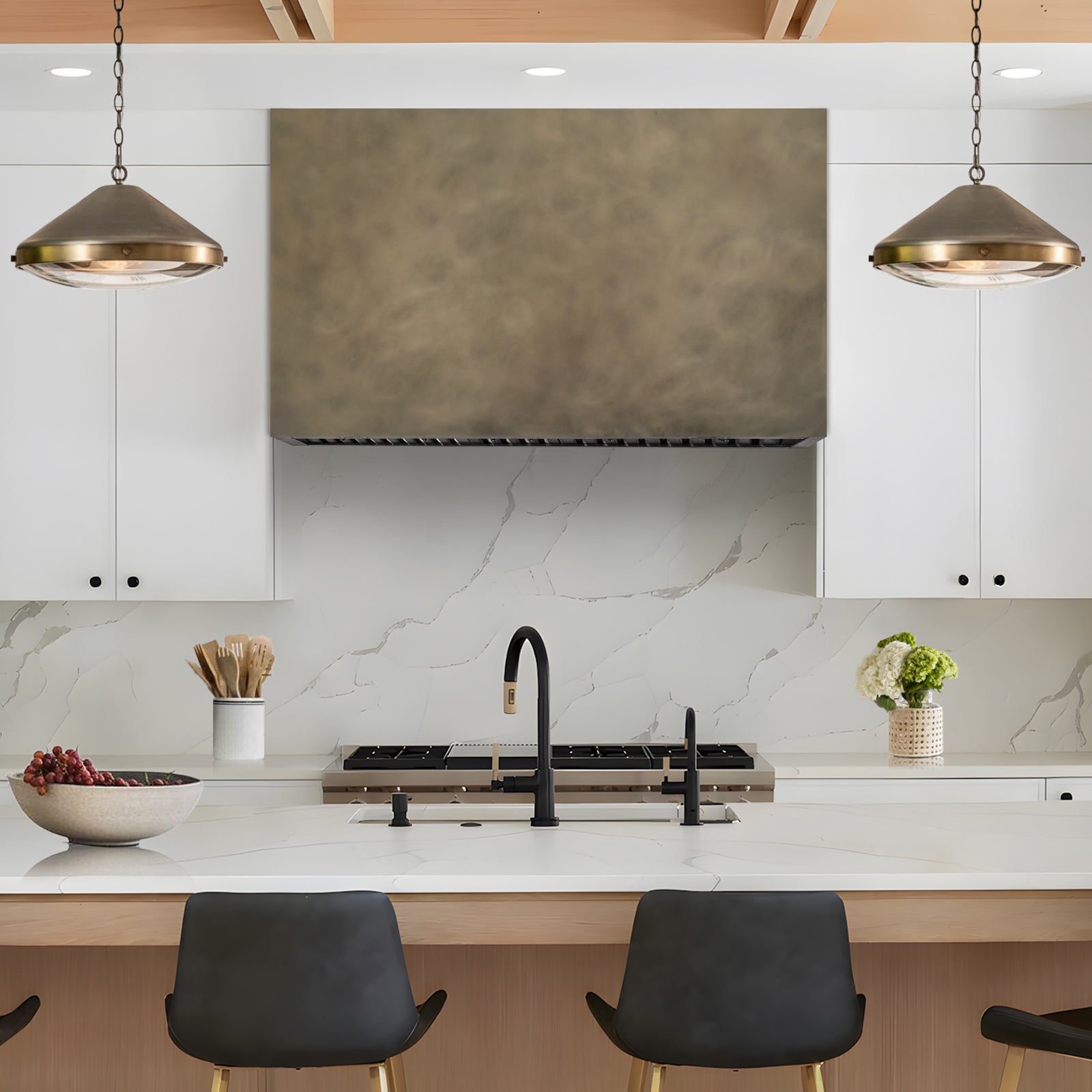 Fobest Custom Retro Brass Range Hood installed in Modern kitchen with marble backsplash and brass pendants.