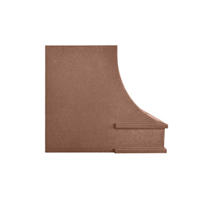 Decorative copper range hood with intricate designs on a white background