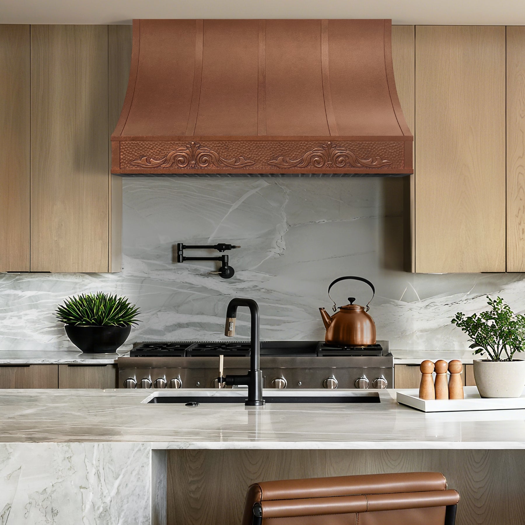 Modern kitchen with vintage copper range hood and decorative elements