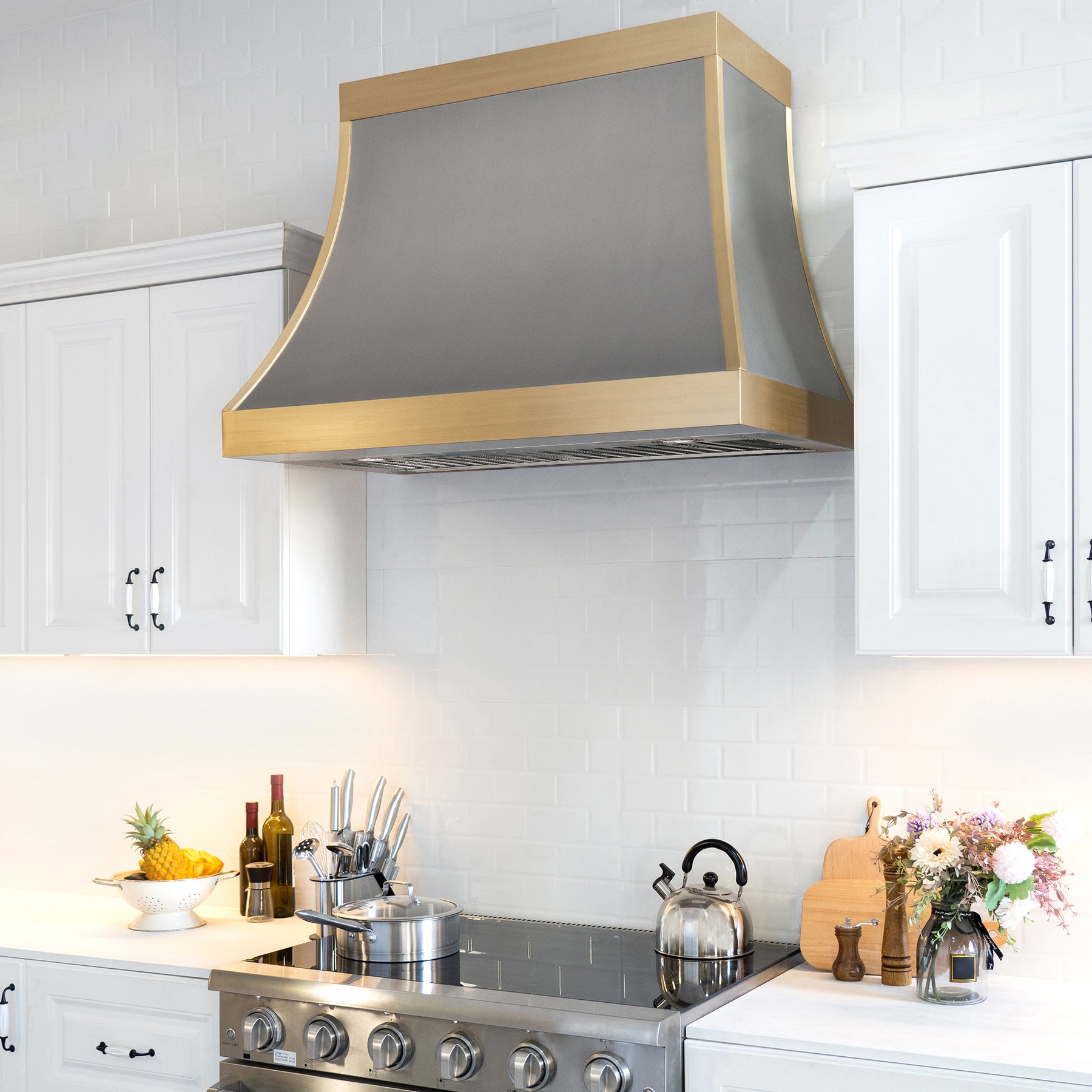 Fobest brushed stainless steel range hood with brushed brass straps