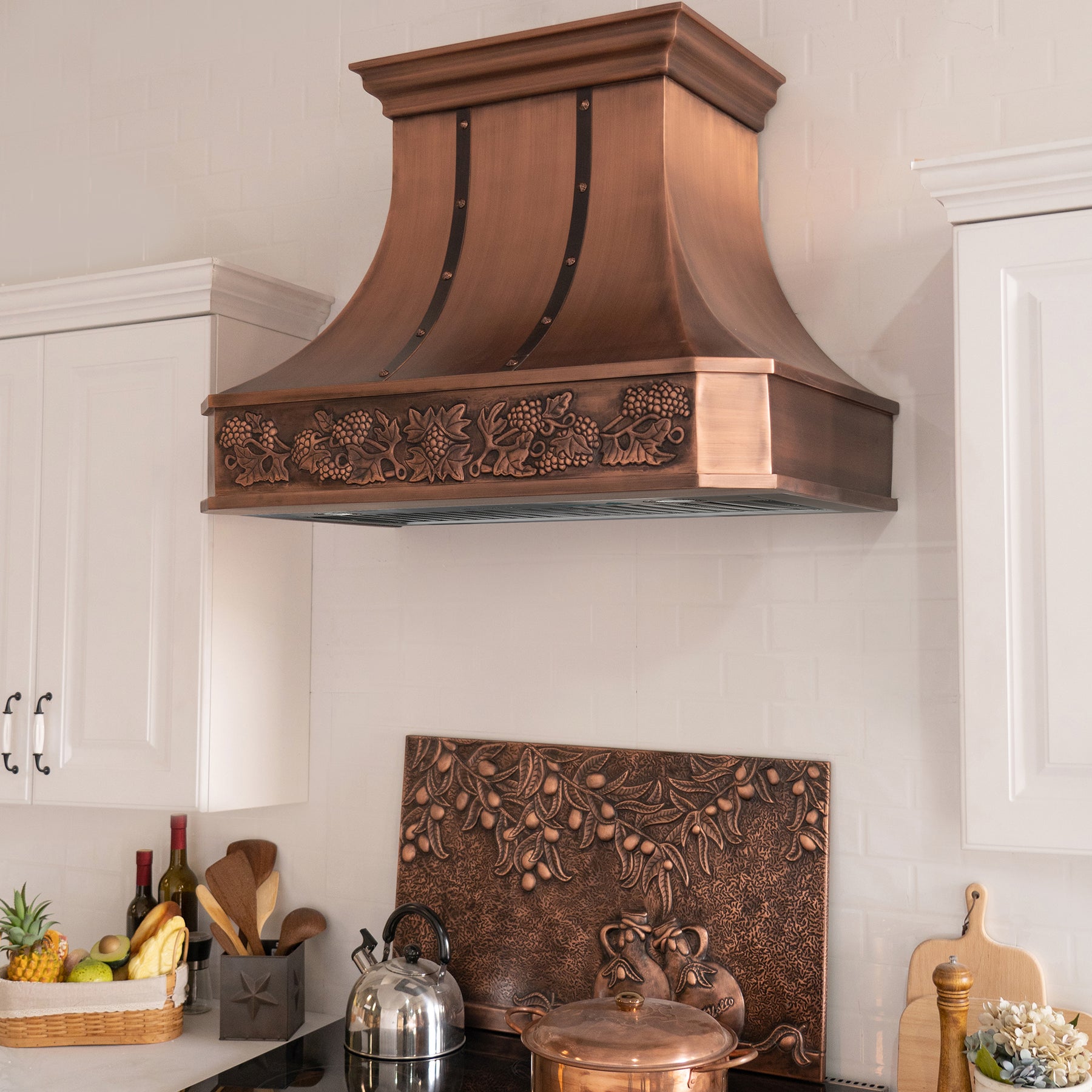 Fobest custom copper range hood with apron design