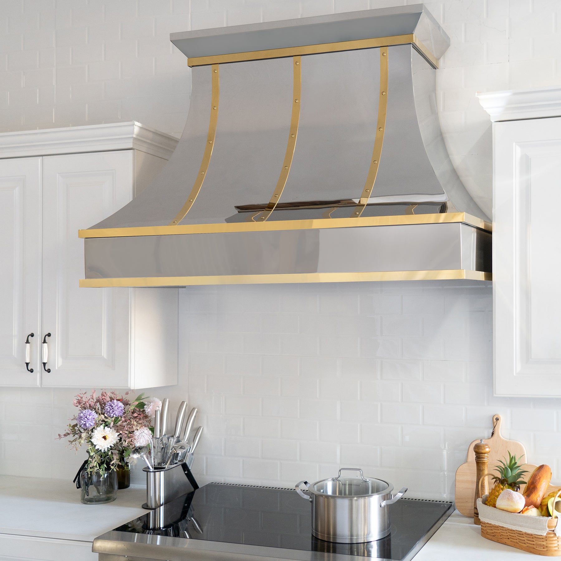 Fobest custom polished stainless steel range hood with brass straps rivets